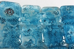 Bubble Mosaic slump: Bullseye glass, copper oxide and copper wire inclusions 30 x 30 cm