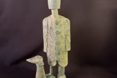 Figure-with-clogs-and-dog