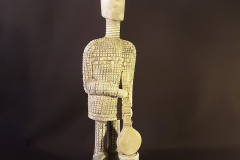 Figure-with-musical-instrument